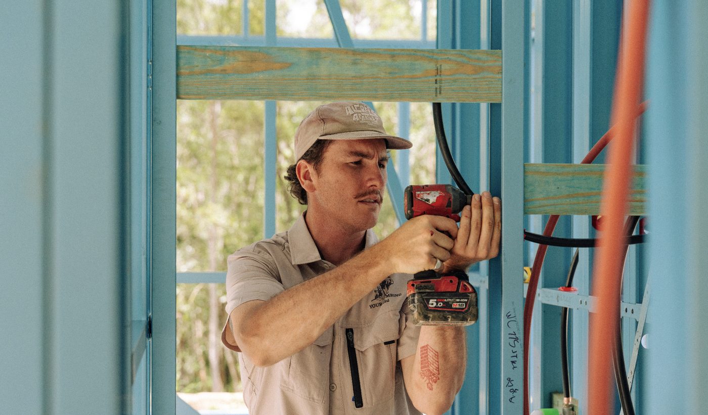 Fitting out rough-in pipework at frame stage