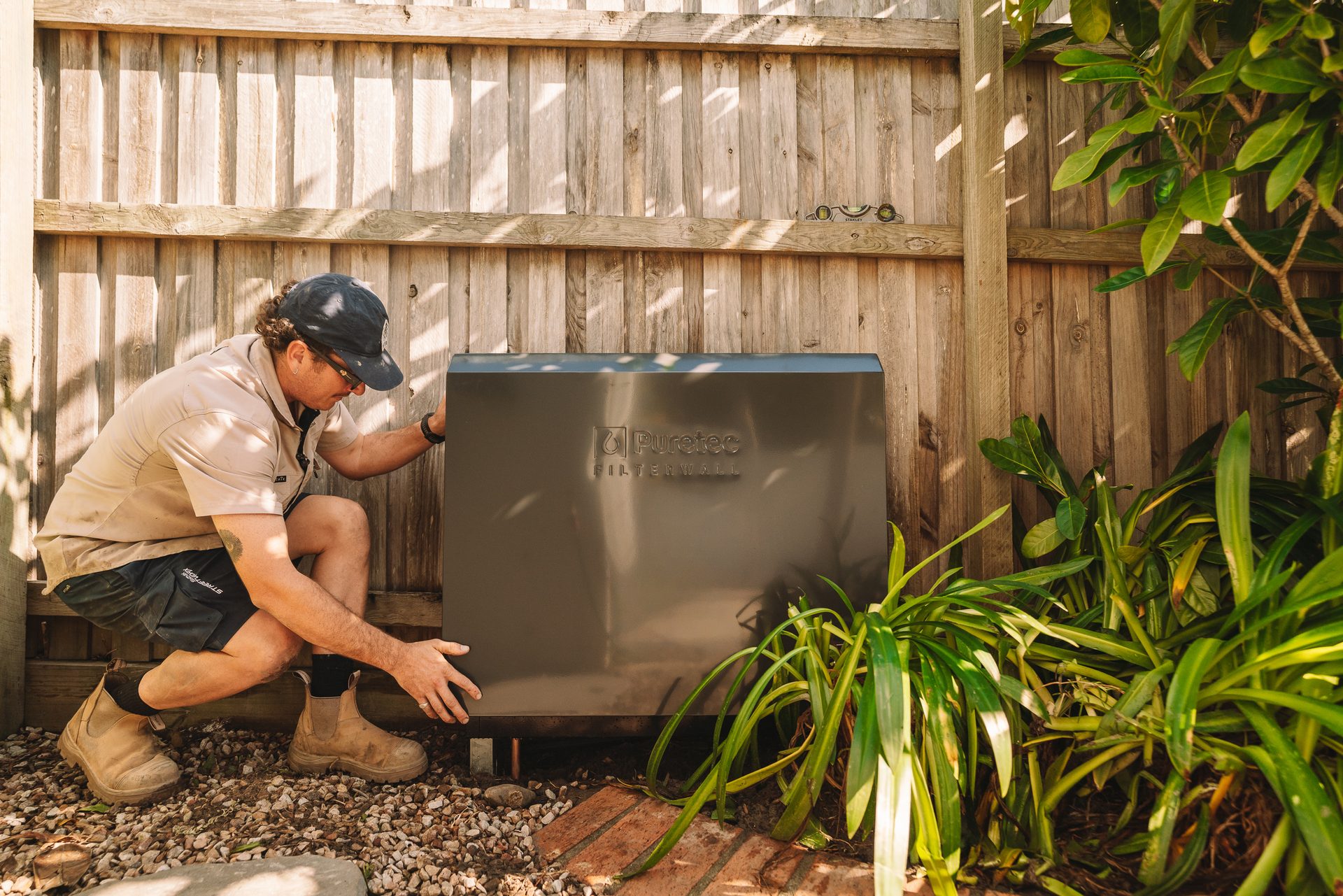 Plumber installing a whole-home water filtration system